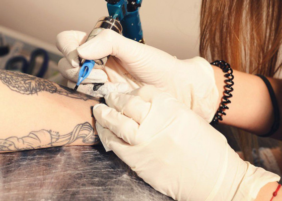 Woman having a tattoo