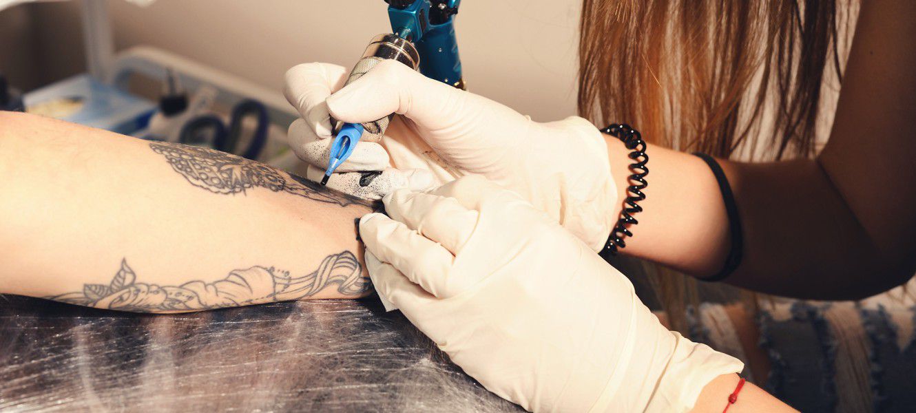 Woman having a tattoo